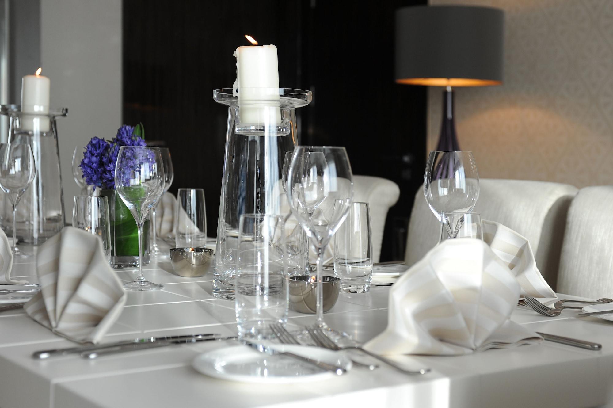 Millennium Al Rawdah Hotel Abu Dhabi Exterior photo A table setting at the restaurant