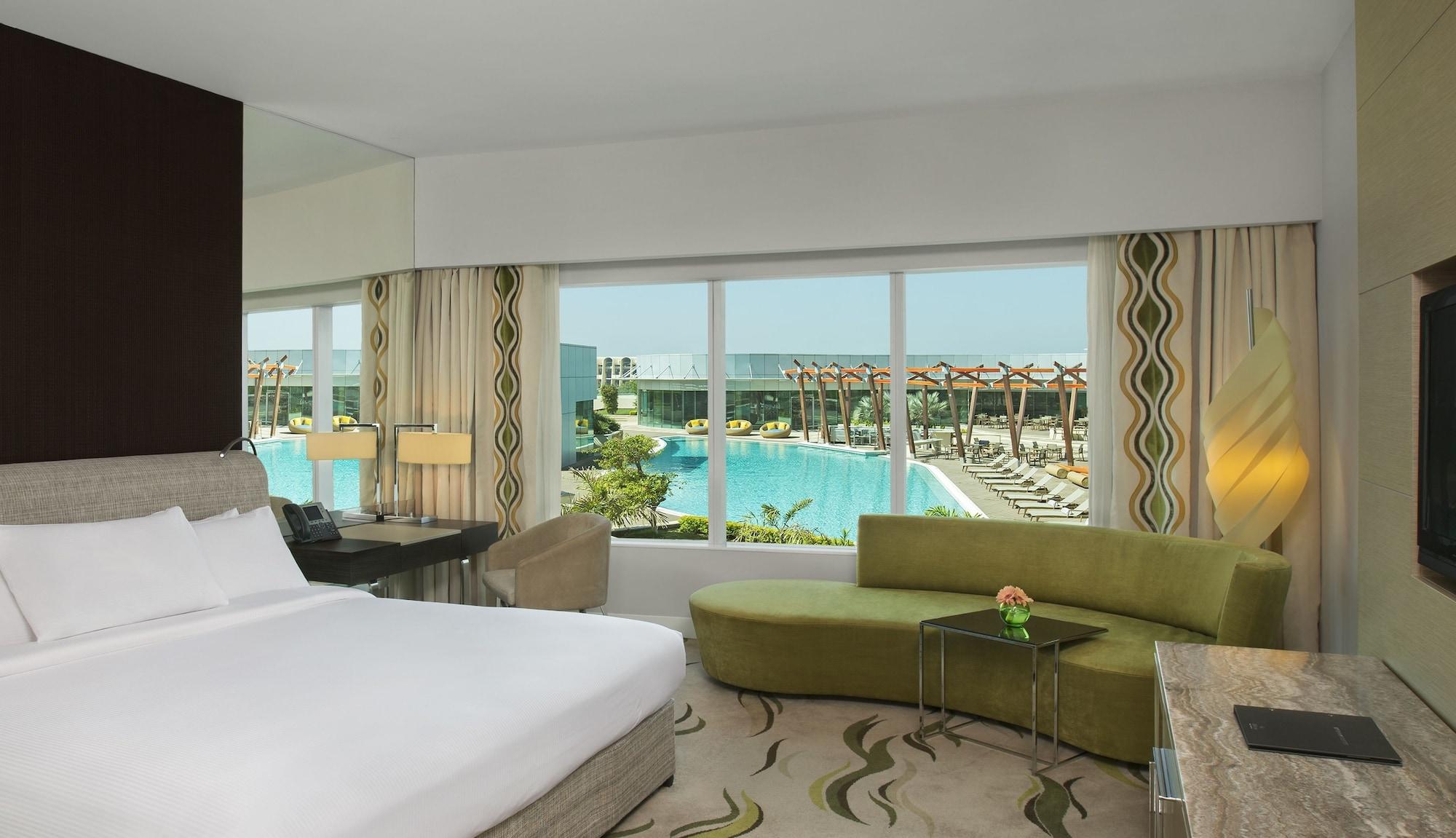 Millennium Al Rawdah Hotel Abu Dhabi Exterior photo A view of the pool from a room at Jumeirah Jumeirah