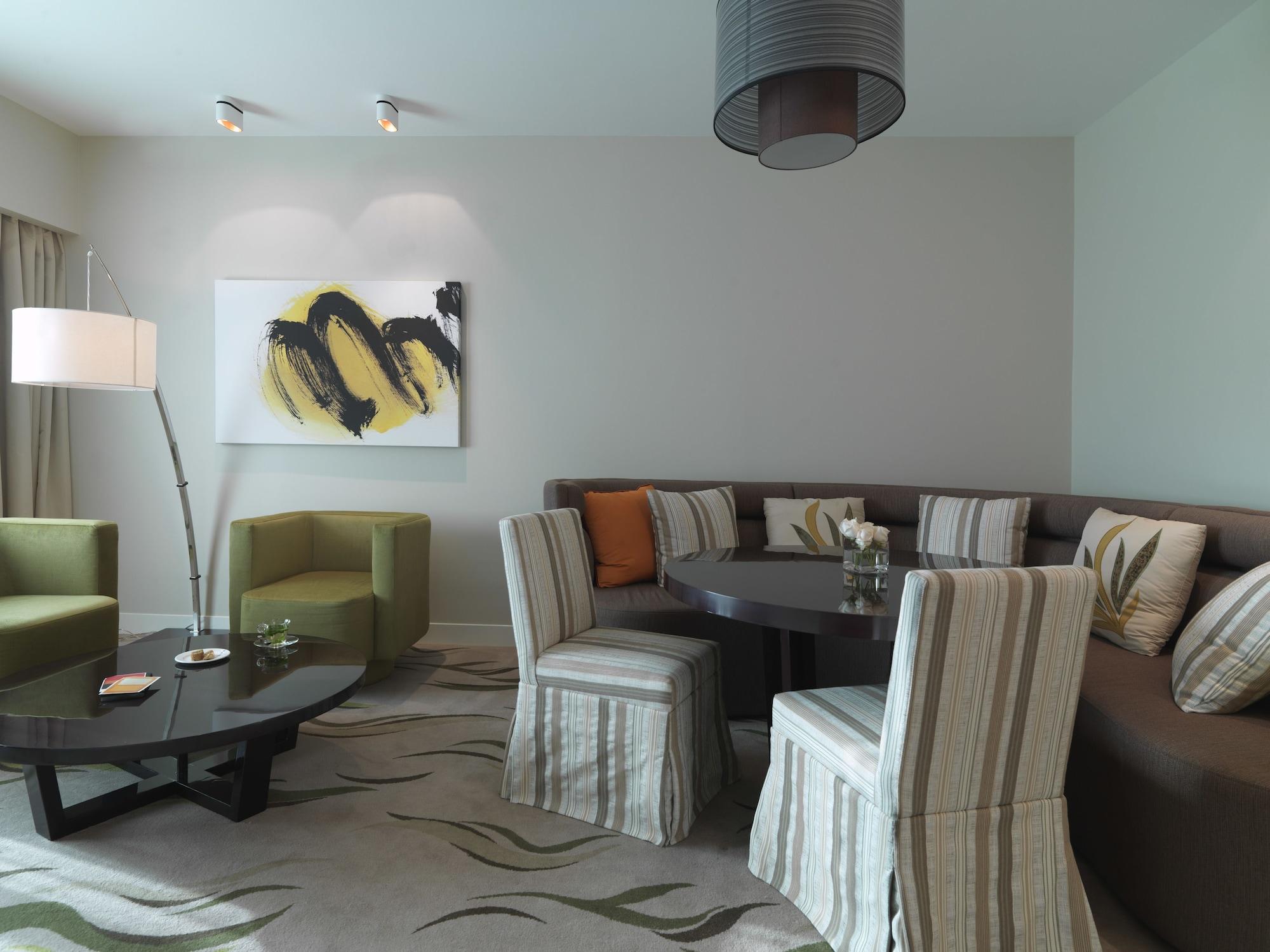 Millennium Al Rawdah Hotel Abu Dhabi Exterior photo A living room in a suite at the Mandarin Oriental, Bangkok