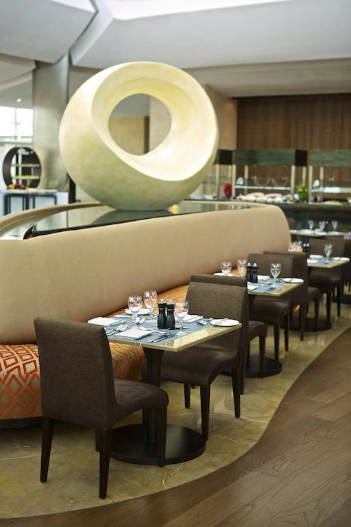 Millennium Al Rawdah Hotel Abu Dhabi Exterior photo The restaurant's interior