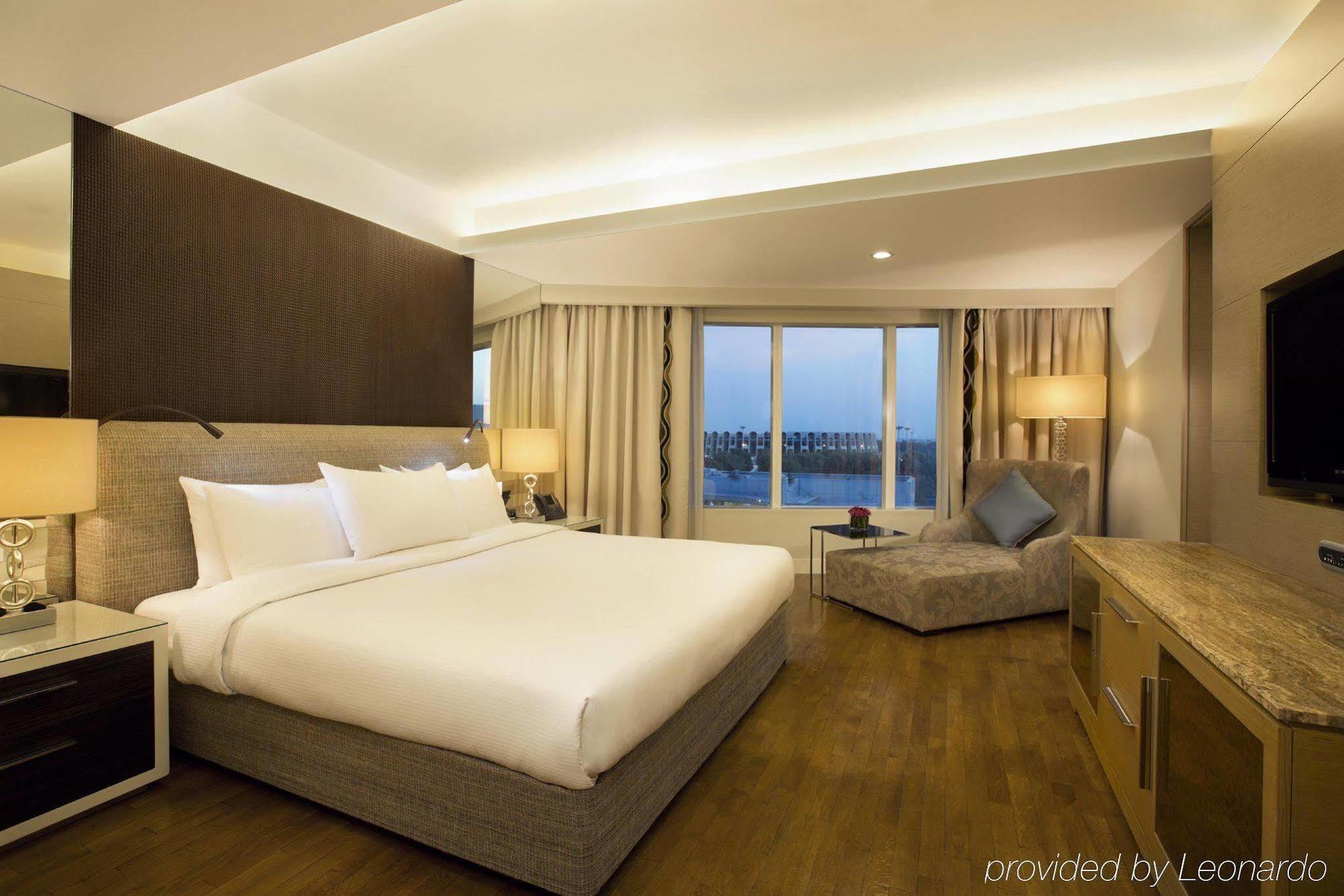 Millennium Al Rawdah Hotel Abu Dhabi Exterior photo A room at the hotel