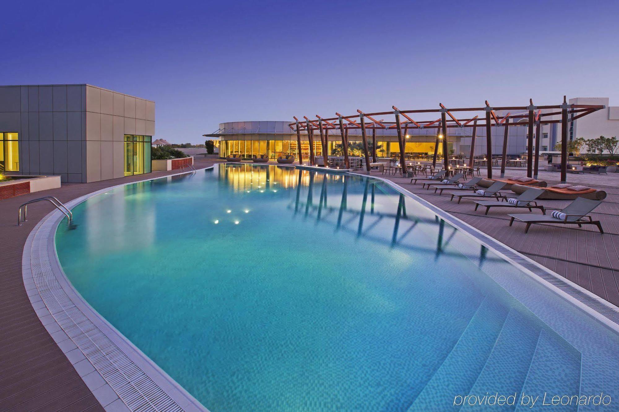 Millennium Al Rawdah Hotel Abu Dhabi Exterior photo Swimming pool