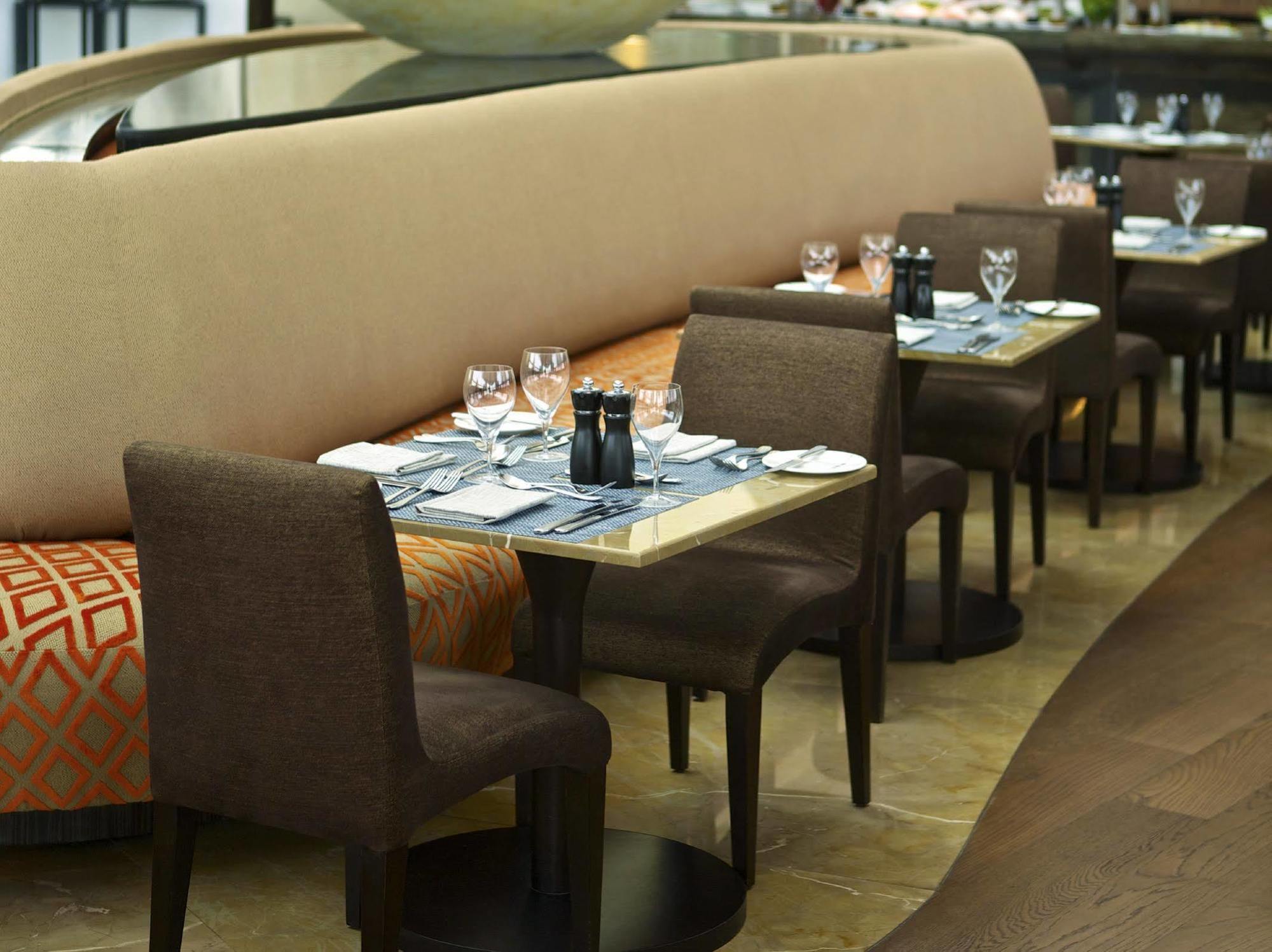 Millennium Al Rawdah Hotel Abu Dhabi Exterior photo The restaurant's interior