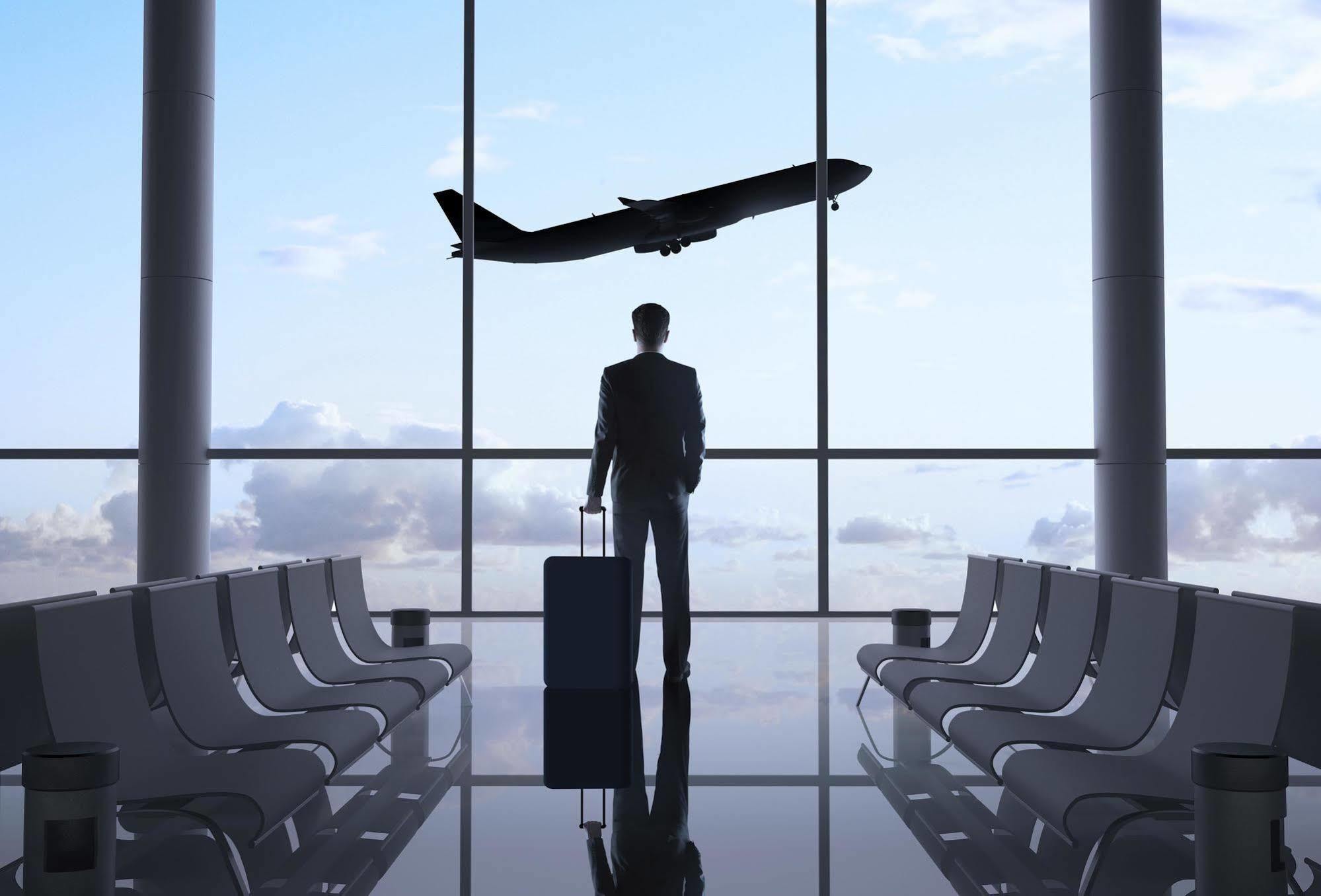 Millennium Al Rawdah Hotel Abu Dhabi Exterior photo A man waiting for a flight at the airport